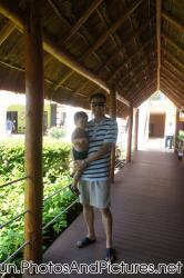 Darwin held by daddy under a covered walkway at Ocean Coral & Turquesa.jpg