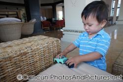Darwin plays with cars at Ocean Coral & Turquesa lobby.jpg