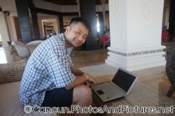 David uses a laptop at Ocean Coral & Turquesa lobby.jpg