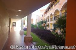 Hallway next to plants at a condo complex at Ocean Coral & Turquesa.jpg