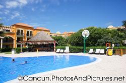 Laughing sunflower and hut next to pool at Ocean Coral & Turquesa.jpg