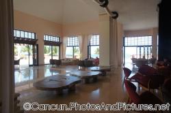 Natural shape wooden tables and red chairs at Ocean Coral & Turquesa lobby.jpg