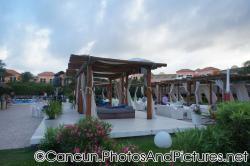 Outdoor Canopies with beds and seats with white drapes at Ocean Coral & Turquesa.jpg